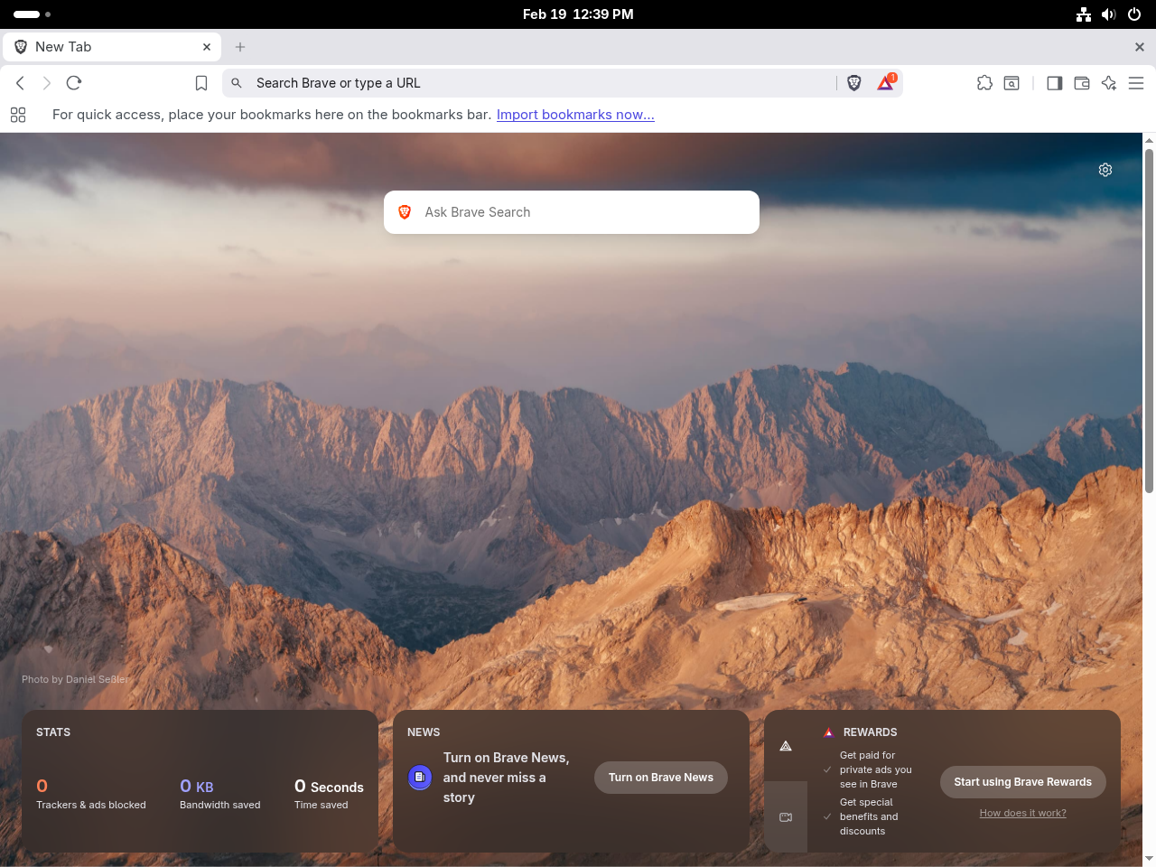 Brave Browser new tab page showing ad and tracker blocking stats on Fedora